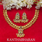 Gold-tone floral links lead to a multicolor pendant, finished with white beads and rounded drops.